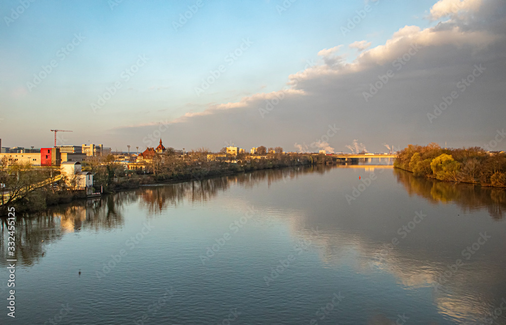view to river Main with Frankfurt Hoechst at the horizon in sunrise