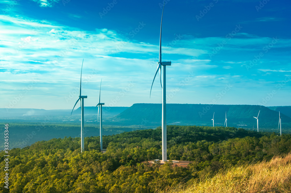Landscape of windmill with green forest and clear blue sky