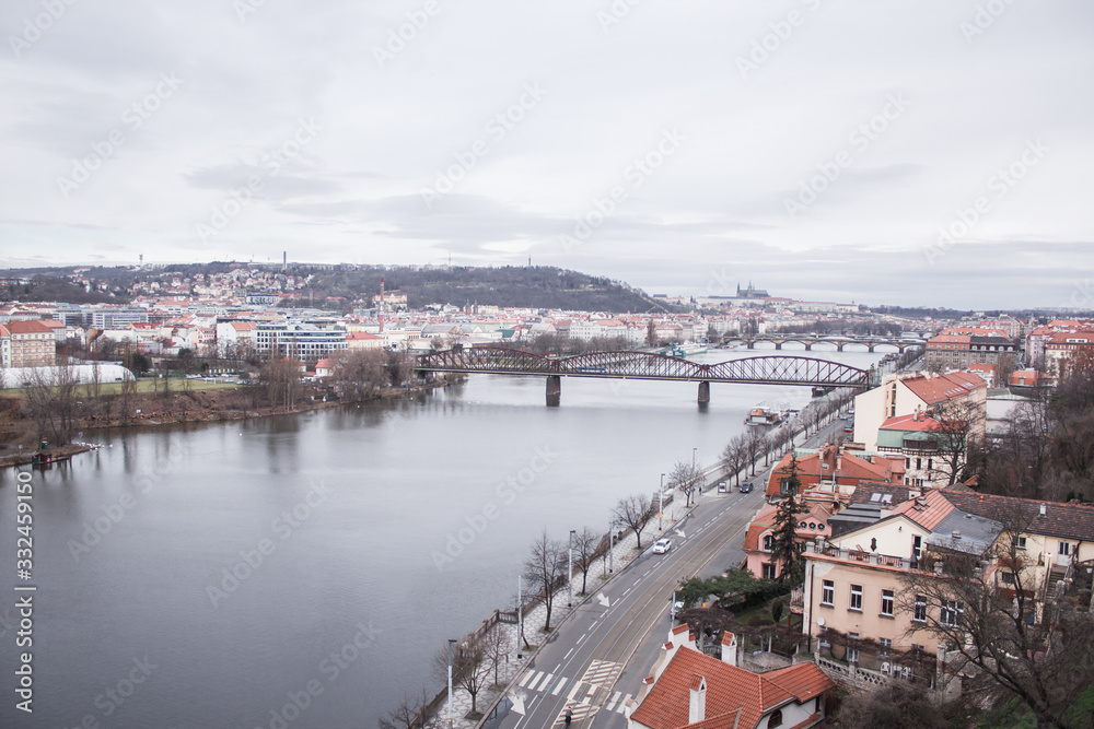 view of the roofs, river and bridges of Prague