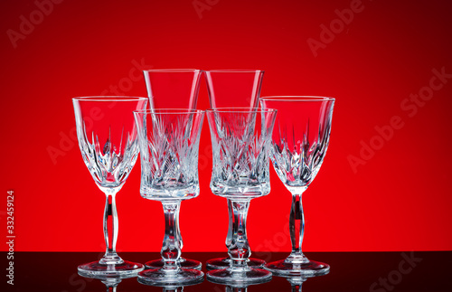 Crystal glasses shot close-up on a red background