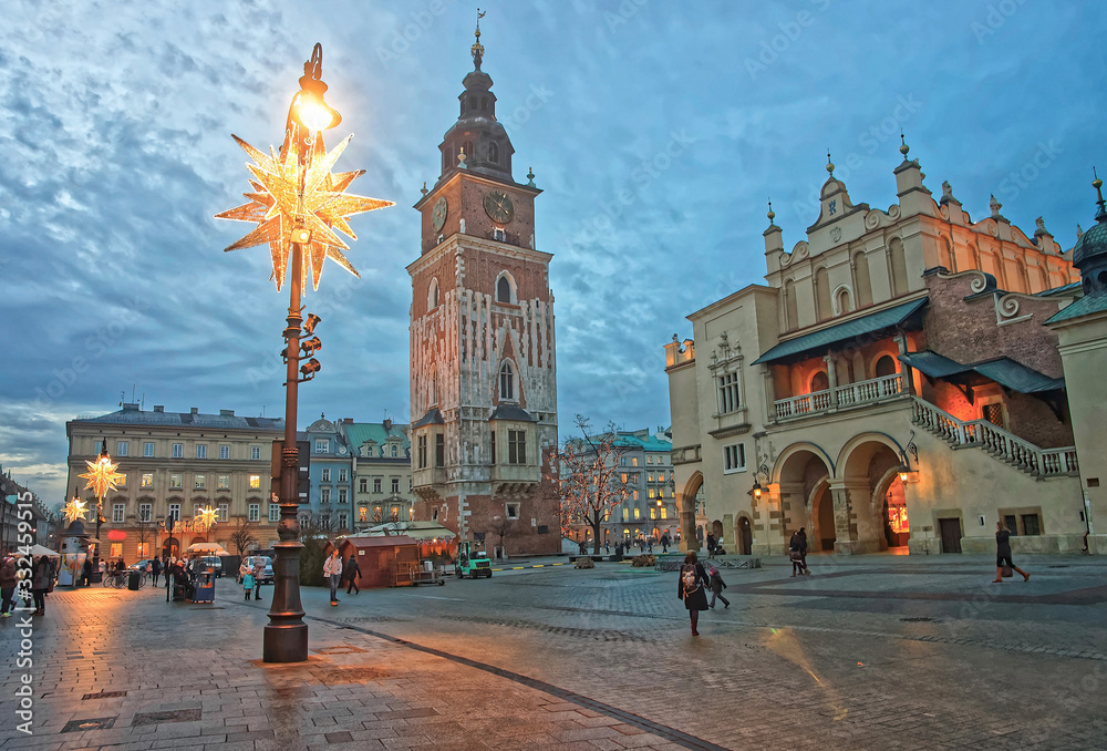 Fototapeta premium Cloth Hall and Town Hall Tower in the Main Market Square of the Old City in Krakow in Poland at Christmas time
