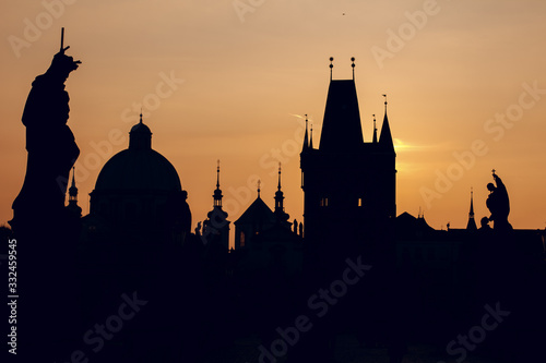 silhouette of cathedral and tower on the Charles Bridge at sunrise