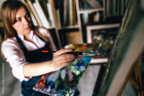 artist girl with brush for painting photo