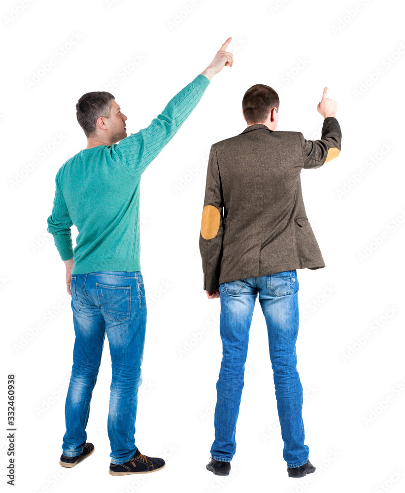 Back view of two man in sweater pointing.