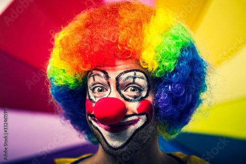 Funny clown in a colorful background
