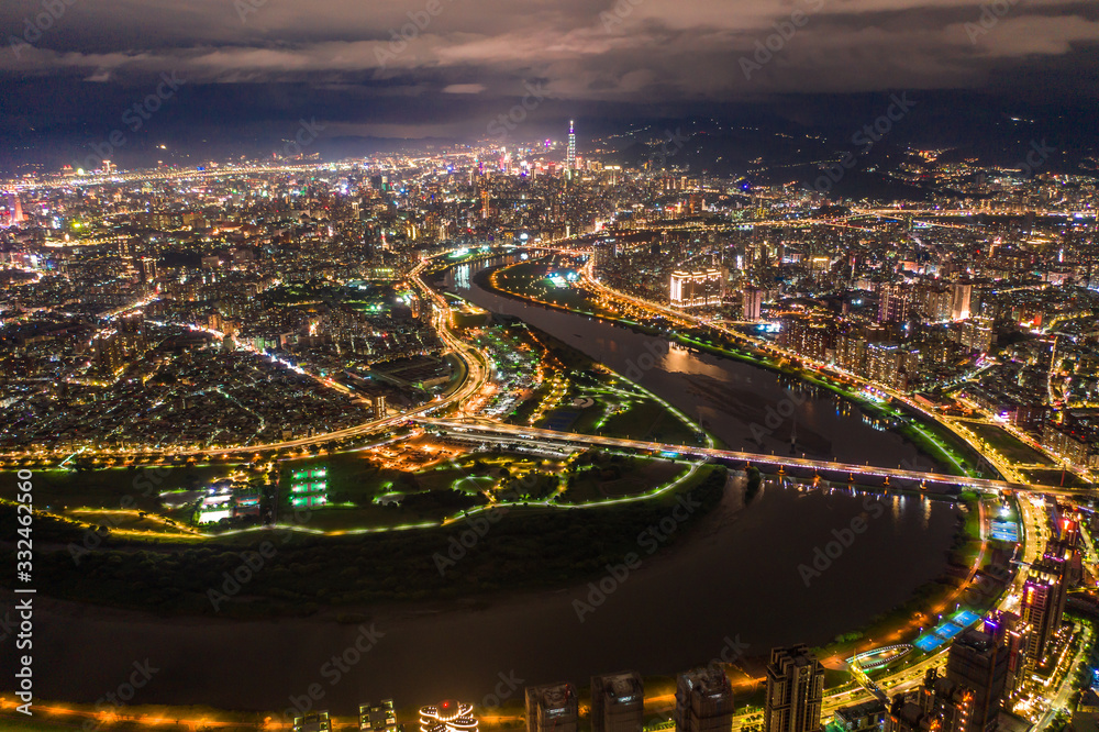 Taipei City Aerial View - Asia business concept image, panoramic modern cityscape building bird’s eye view under at night, shot in Taipei, Taiwan.