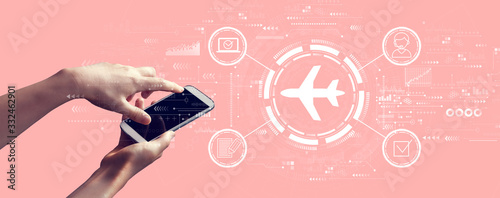 Flight ticket booking concept with person holding a white smartphone