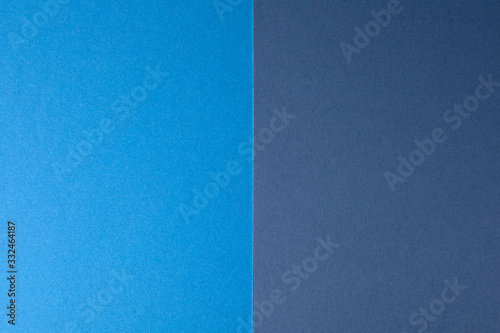 Light blue and dark blue paper background, copy space.