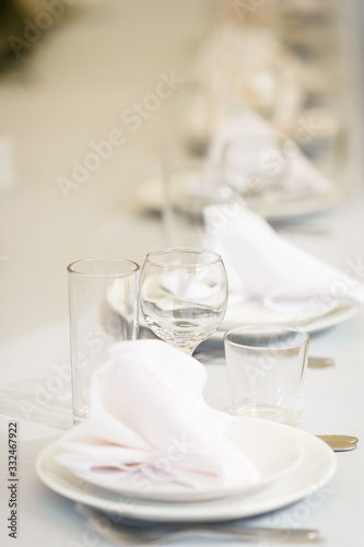 Glasses for wine and champagne on a served table at a banquet