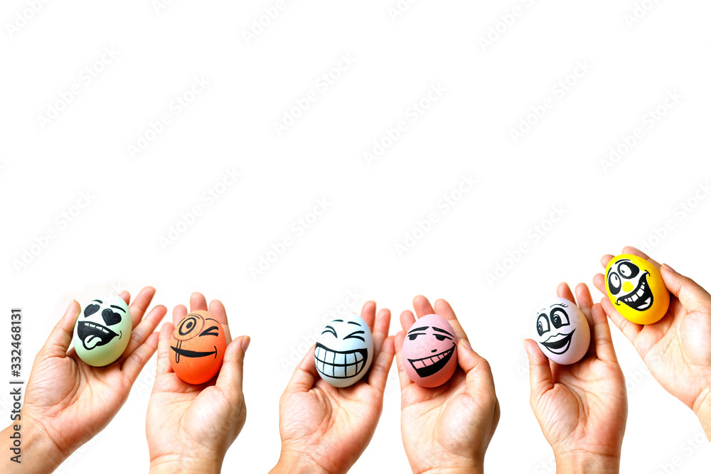Perfect colorful handmade easter eggs with smile eggs in human hand isolated on a white background. Easter day concepts. Funny decoration. Happy Easter.