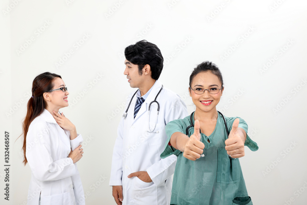 young asian malay chinese male female doctor on white background thumbs up looking at camera young asian malay chinese male female doctor on white background thumbs up looking at camera