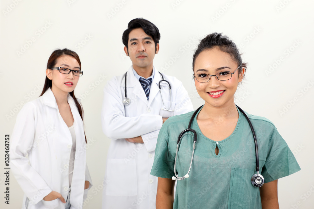 Young asian malay chinese male female doctor on white background smile confident looking at camera Young asian malay chinese male female doctor on white background smile confident looking at camera