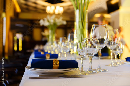 Wine glasses and champagne flutes on table, Wedding decor. Selective focus