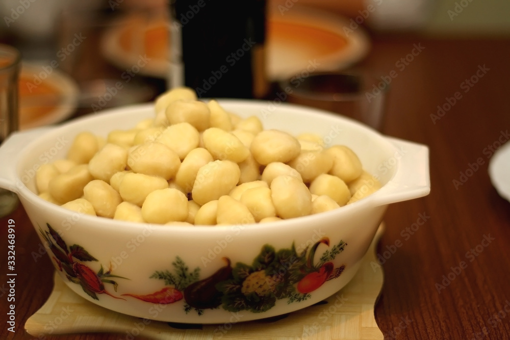 Bowl of cooked gnocchi. Selective focus. Bowl of cooked gnocchi. Selective focus.