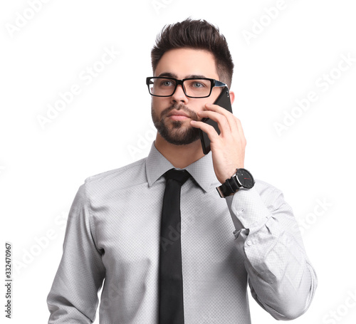 Young businessman talking on smartphone against white background