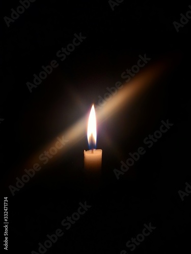 a candle lights up in the dark