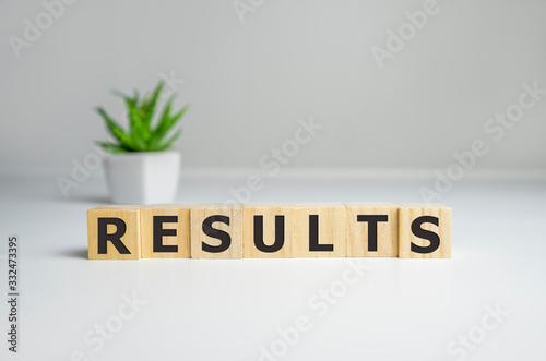 Results - words from wooden blocks with letters, result concept, top view background photo