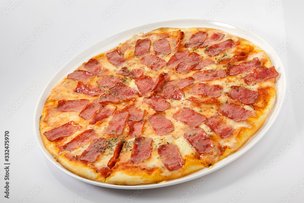 Flatlay of Italian pizza on wooden background. Rustic homemade pizzas with salami, bacon,  cheese, eggs and raw vegetables on shabby wooden background. Healthy vegetarian fungi pizza