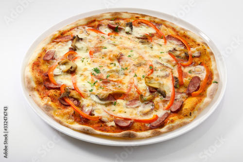 Flatlay of Italian pizza on wooden background. Rustic homemade pizzas with salami, bacon, cheese, eggs and raw vegetables on shabby wooden background. Healthy vegetarian fungi pizza