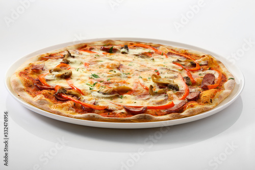 Flatlay of Italian pizza on wooden background. Rustic homemade pizzas with salami, bacon,  cheese, eggs and raw vegetables on shabby wooden background. Healthy vegetarian fungi pizza