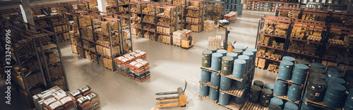Canvas Print interior of a large warehouse with stored material and means for moving the pallets