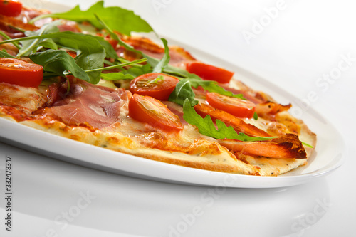 Flatlay of Italian pizza on wooden background. Rustic homemade pizzas with salami, bacon,  cheese, eggs and raw vegetables on shabby wooden background. Healthy vegetarian fungi pizza