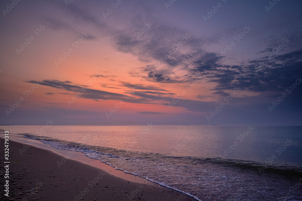 Soft pink sunrise at sea. Seascape. Black Sea