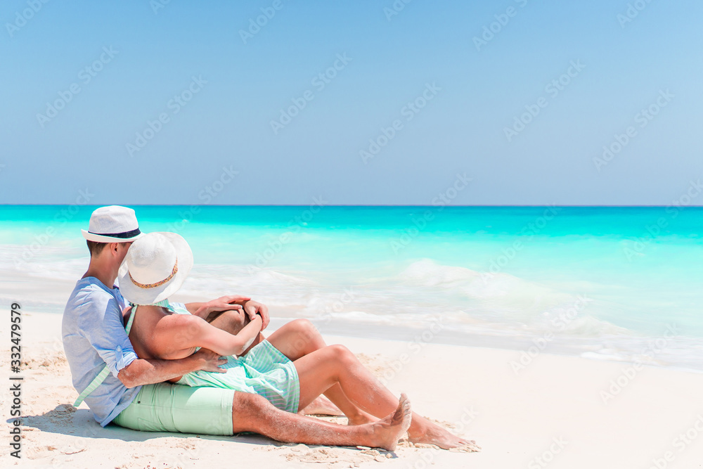 Young couple on white beach during summer vacation. Young couple on white beach during summer vacation.