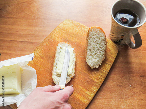 cutting board with knife and fork on wooden table