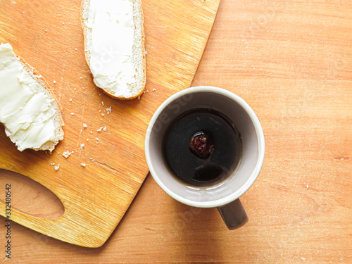 cup of coffee and cookies on wooden table