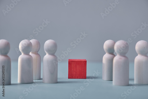 Wooden red cube and figures. Mock up, copy space.