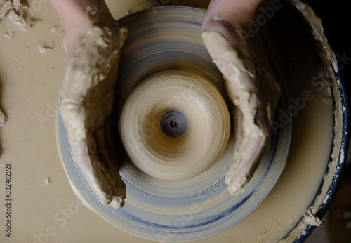 The master works behind the potter's wheel