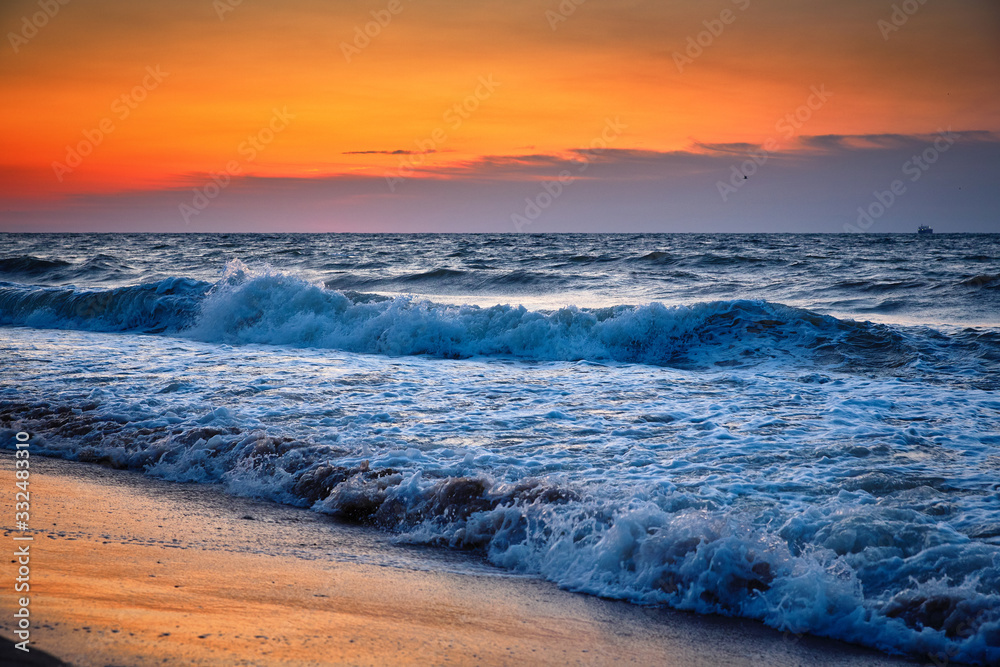 Sea waves and Beautiful dawn sunrise at sea. Seascape.