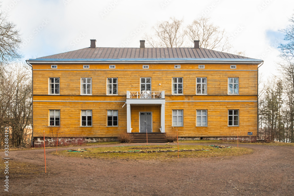 Kouvola, Finland - 19 March 2020: Beautiful yellow old building of abandoned Anjala manor. The building was built at the turn of the 19th century and belonged to the Wrede family from 1837.