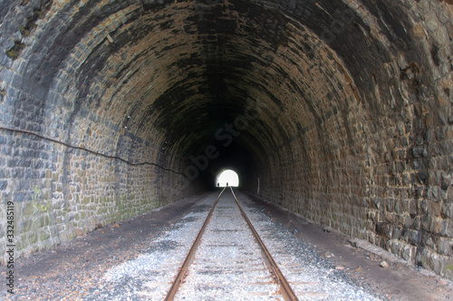 A tunnel with an abandoned railway running along the shore of Lake Baikal.