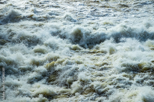 Splashing water waves on the spring fast river