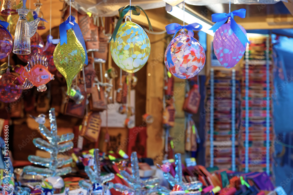 Fototapeta premium Christmas tree decorations displayed for sale at the Christmas market