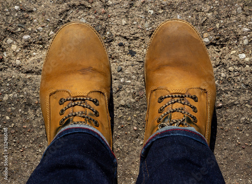 Yellow boots on concrete