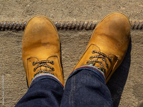 Yellow boots on concrete