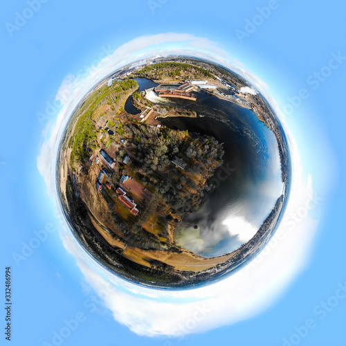 A three dimensional panoramic view of hydroelectric power generation plant in Anjala at Kymijoki river, Finland in a mini planet panorama style. photo