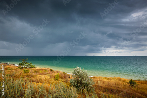 Fototapeta Naklejka Na Ścianę i Meble -   Seashore, clouds over the sea. The Black Sea.