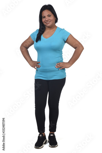  woman with sportswear on white background, hands on hip