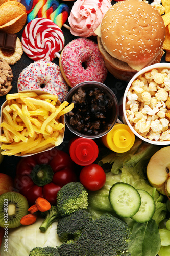 healthy or unhealthy food. Concept photo of healthy and unhealthy food. Fruits and vegetables vs donuts,sweets and burgers