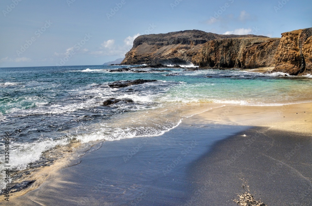 White and black sand beach in one, on the islet of Djeu, Cabo Verde