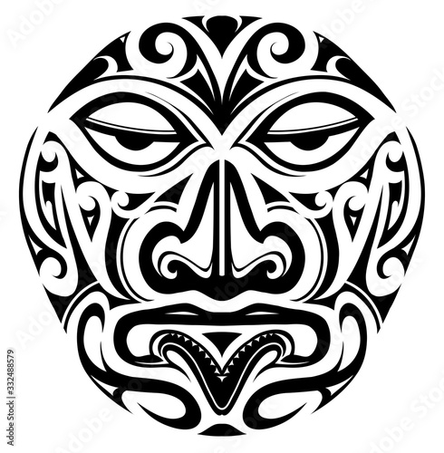 Polynesian style mask tattoo