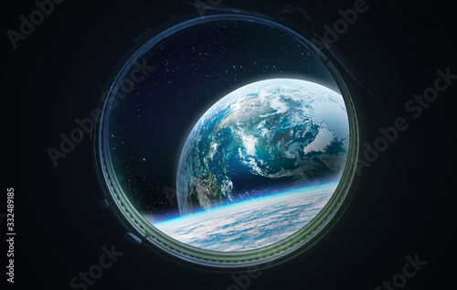 View on Earth planet from porthole of space station. Blue planet and space. Elements of this image furnished by NASA photo