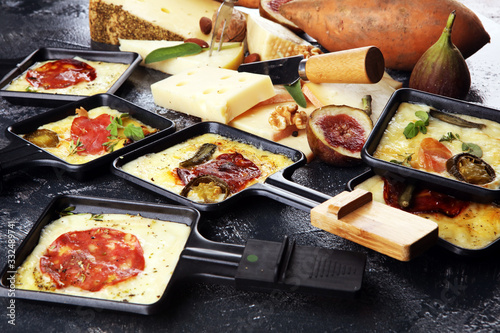 Delicious traditional Swiss melted raclette cheese on diced boiled or baked potato.