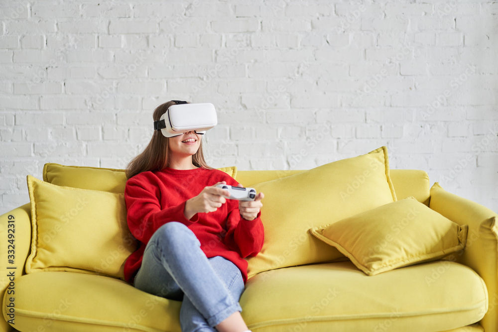 Portrait of amazed excited woman watching virtual reality glasses with open mouth expression