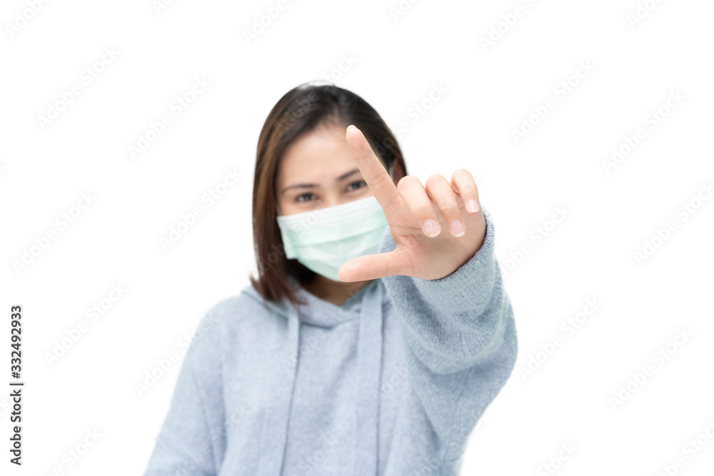 Girl wearing mask again flu and covid-19,corona virus and make hand sign Girl wearing mask again flu and covid-19,corona virus and make hand sign