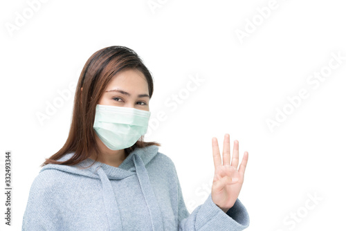 Girl wearing mask again flu and covid-19,corona virus, put up four fingers